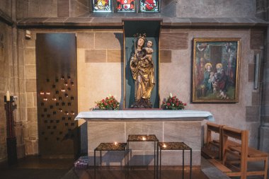 Statues of saints and icons in the ancient Coatolic Gothic Cathedral of Nuremberg, Germany. High quality photo
