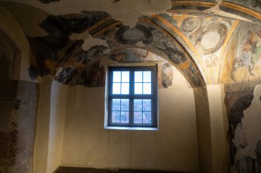 An ancient window overlooking the tiled roofs of Nuremberg, Germany. High quality photo