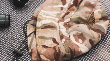 Panama of the British military lies on a camouflage grid. High quality photo