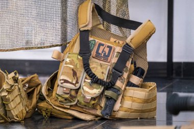 The bulletproof vest of the Ukrainian military lies on the floor. High quality photo