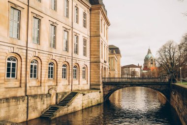 View on historical new town hall in Hannover Germany with Leine river. Beautiful cityscape