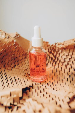 Glass bottle of cosmetic product. Skincare concept. Organic spa cosmetics.