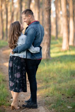 Young couple tenderly embracing each other on a sunny day