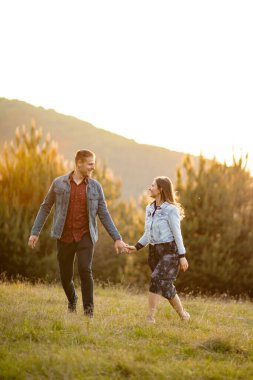 Valentine's Day celebrated by a young couple by walking in nature