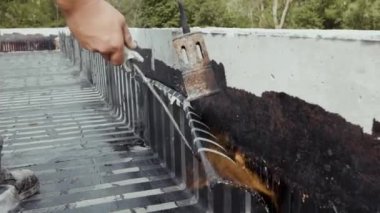 Industrial flat roofing waterproofing system, installed by professionals with a fire burner