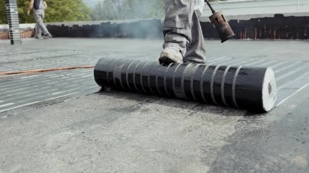 Worker Mounts Flat Roof Vapor Barrier Made Bituminous Membrane Welded — ストック動画