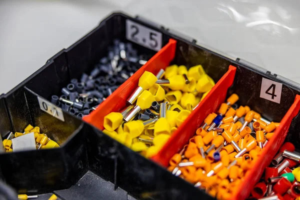 A close up of a tool box with a lot of different electrical pins
