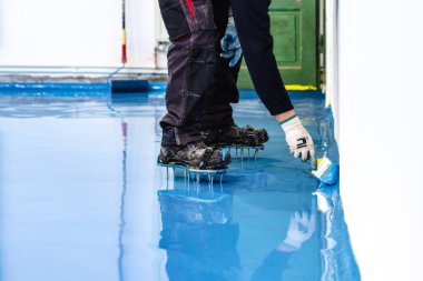 Self leveling blue epoxy floor in the gym
