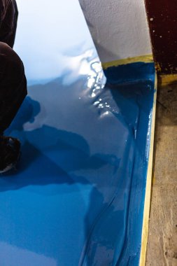 Self leveling blue epoxy floor in the gym