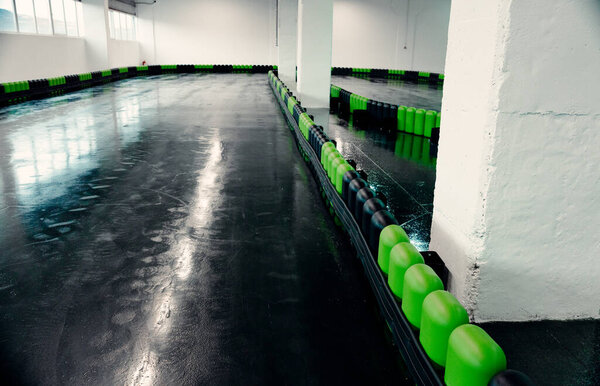 Inside of a Go Kart Play with bumpers in green and black colours