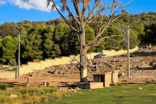 stock image An old stone house with red tile roof in a rural area