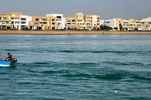 Stock image Two men sailing on a rowboat through the Bou Regreg river in Rabat