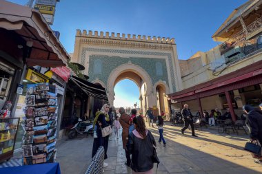 People walking nearby Bab Boujloud in the old Medina of Fes, Morocco