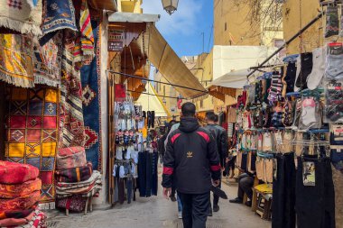 People walking through the marketplace in the old town of Fez, Morocco