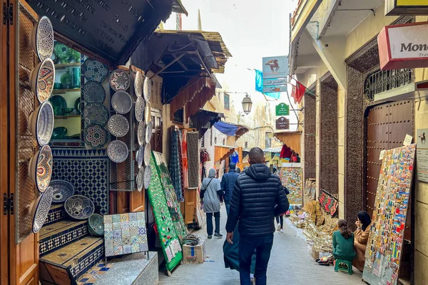 People walking through the marketplace in the old town of Fez, Morocco