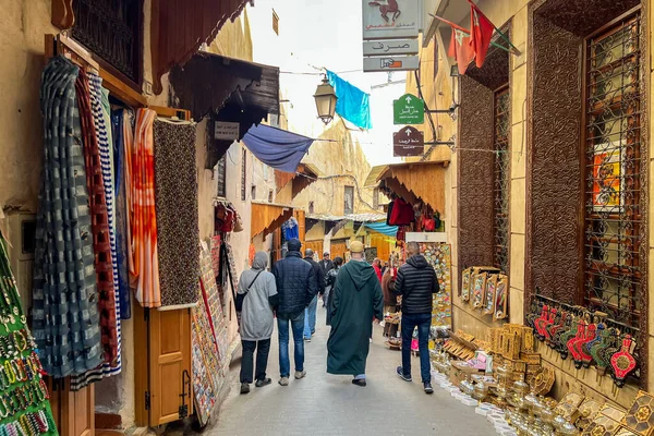 People walking through the marketplace in the old town of Fez, Morocco