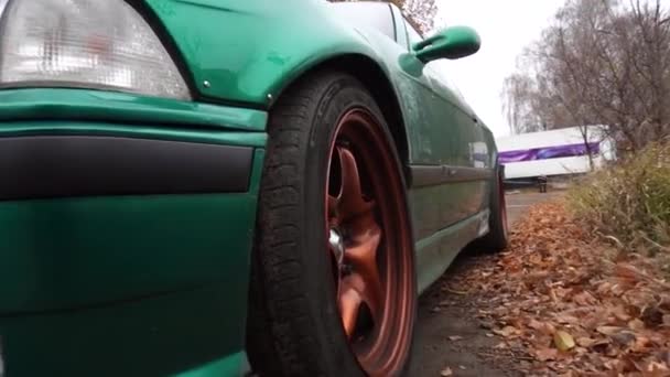 Tuned Green Car Metallic Burnt Orange Rims Dirty Autumn — Stock Video