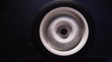 spinning car wheels white shooting video on long exposure motion effect