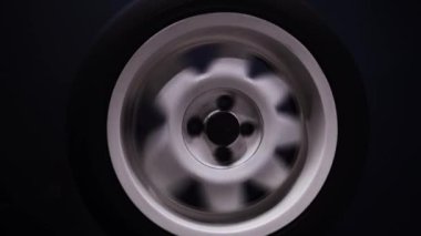 spinning car wheels white shooting video on long exposure motion effect