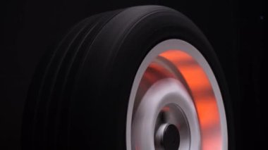 spinning car wheels white shooting video on long exposure motion effect