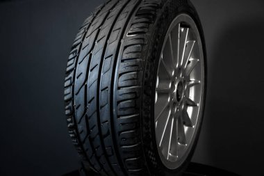 old car wheels titanium rims long exposure video on dark background spinning motion simulation