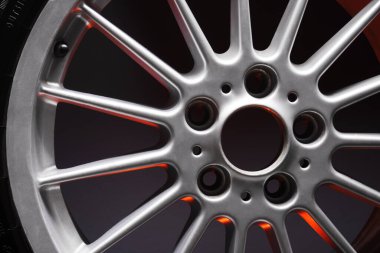 old car wheels titanium rims long exposure video on dark background spinning motion simulation