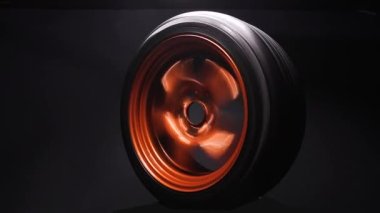 orange metal welded rims car wheels for a drift car custom tuning long exposure video motion blur effect