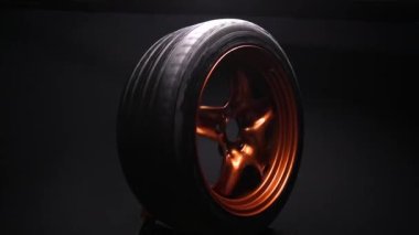 orange metal welded rims car wheels for a drift car custom tuning long exposure video motion blur effect