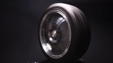 new chrome rims, car wheels for a drift car, custom tuning, long exposure video, motion blur effect