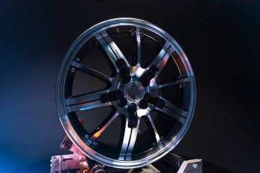 old car wheels titanium rims long exposure video on dark background spinning motion simulation