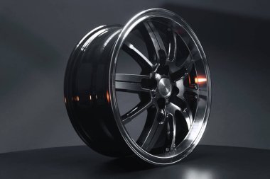 old car wheels titanium rims long exposure video on dark background spinning motion simulation