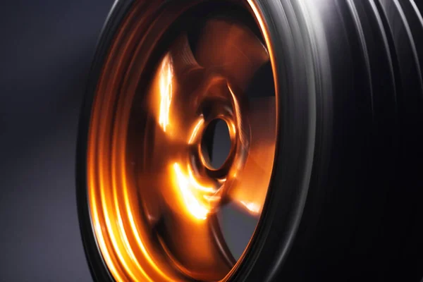 orange metal welded rims car wheels for a drift car custom tuning long exposure photo motion blur effect
