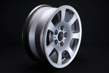 old car wheels titanium rims long exposure video on dark background spinning motion simulation
