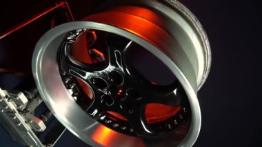 old car wheels titanium rims long exposure video on dark background spinning motion simulation
