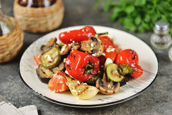 Grilled vegetables with olive oil, lemon juice and feta cheese.