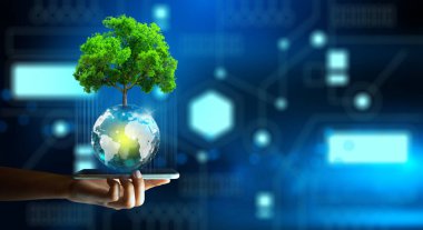 Man hand holding smartphone with Technology Economic. Tree growing on crystal ball and abstract background. Green computing, Green IT, csr, IT ethics, and Environmental friendly Concept.