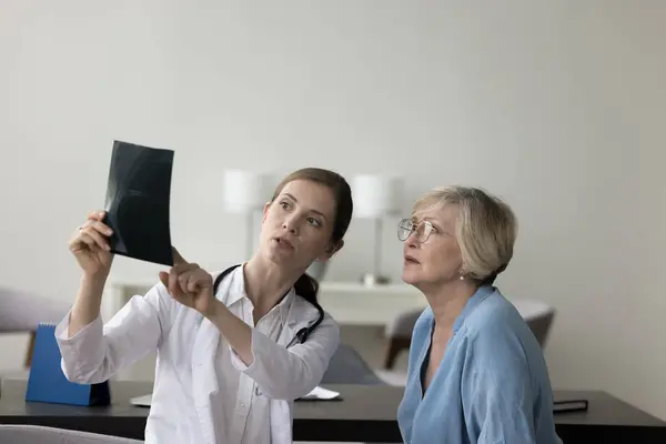 Young Serious Focused Female Therapist White Coat Hold Roentgen Film — Stock Photo, Image