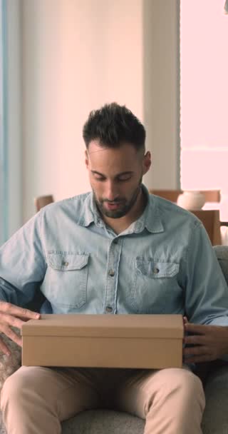 Hispanic Man Commerce Client Sits Couch Opens Parcel Box Feels — Stock Video