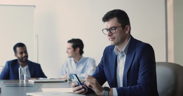 Mature Businessman Formal Suit Sit Desk Holds Smartphone Read Message — Stockvideo