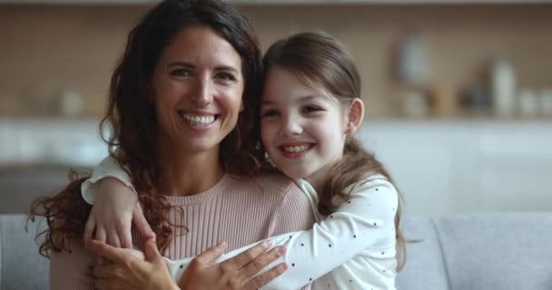 Close Portrait Pretty Little Daughter Embracing Her Young Mom Smiling — Stock Video