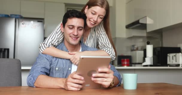 Attractive Hispanic Couple Using Digital Tablet Kitchen Enjoy New Amusing — Stock Video