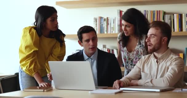 Four Multiracial Colleagues Talking Brainstorm Using Laptop Cooperate Office Briefing — Stock Video
