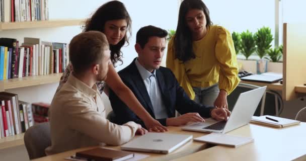 Group Diverse Young Colleagues Using Laptop Gathered Together Office Boardroom — Stock Video