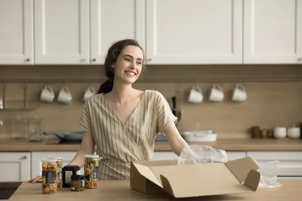Happy Pretty Adult Girl Unpacking Cardboard Box Canned Vegetables Kitchen Stock-billede