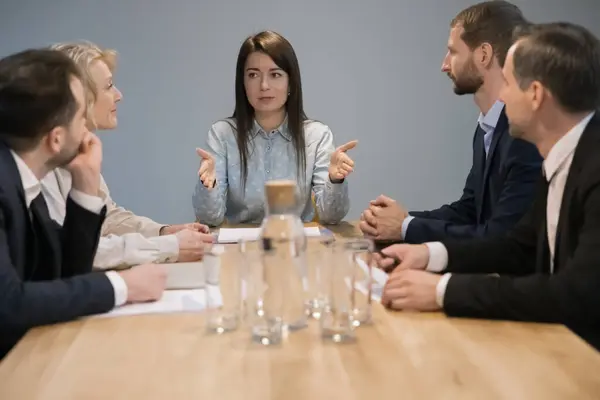 Serious Confident Young Business Woman Talking Employees Meeting Table Giving Stock-billede