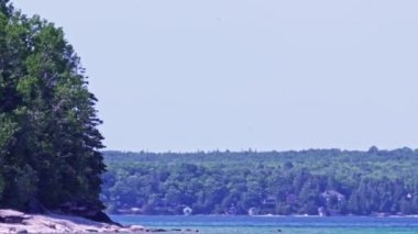Houses cottages or villas at Lake Huron Lion's Head Beach Harbour in Lion's Head Provincial Park Ontario Canada. Isthmus Bay, Lion's Head Point. Cottages for rent and personal leisure.