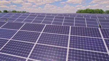 Solar panels aerial view. Modern photovoltaic electricity system created electric power generation without deforestation and environment impact. Green energy and Climate change concept.