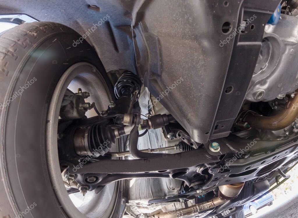 View of car suspension system and various chassis components