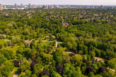 Aerial view of Saint Andrews Presbyterian Church in Scarborough green park. Sunny summer day and green trees with small city church. Place for worship, Bible studies and social outreach in community.
