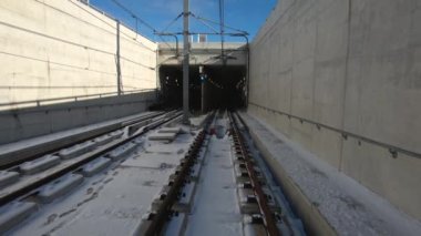 LRT rail way along Eglinton Avenue, connecting Mount Dennis in the west to Kennedy Station in the east. Surface level tracks. Improved transit service.